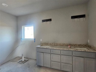 This home offers a comfortable and modern living space with a on Hideout Golf Club and Resort  in Texas - for sale on GolfHomes.com, golf home, golf lot