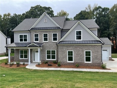 Stunning 2-story home with a 3rd car garage in a coveted on Traditions of Braselton Golf Club in Georgia - for sale on GolfHomes.com, golf home, golf lot