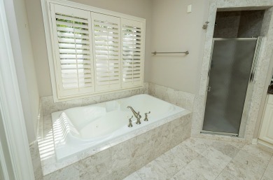 Enjoy luxury living in this stunning executive 1.5-story on Glen Oaks Country Club in Iowa - for sale on GolfHomes.com, golf home, golf lot