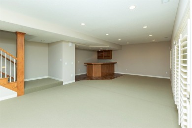 Enjoy luxury living in this stunning executive 1.5-story on Glen Oaks Country Club in Iowa - for sale on GolfHomes.com, golf home, golf lot