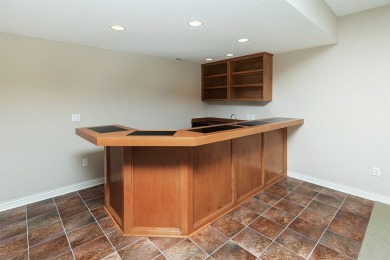 Enjoy luxury living in this stunning executive 1.5-story on Glen Oaks Country Club in Iowa - for sale on GolfHomes.com, golf home, golf lot