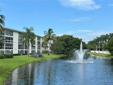 Enjoy resort-style living in Wynmoor's sought-after Antigua I on Wynmoor Golf Course in Florida - for sale on GolfHomes.com, golf home, golf lot