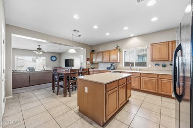 Welcome home to this spacious five-bedroom, three-bath home in on Poston Butte Golf Club in Arizona - for sale on GolfHomes.com, golf home, golf lot