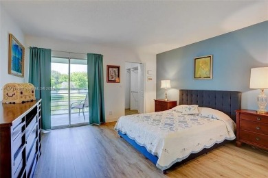 Enjoy resort-style living in Wynmoor's sought-after Antigua I on Wynmoor Golf Course in Florida - for sale on GolfHomes.com, golf home, golf lot