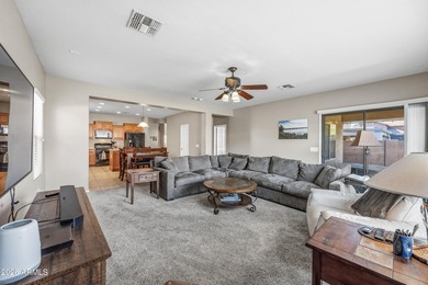 Welcome home to this spacious five-bedroom, three-bath home in on Poston Butte Golf Club in Arizona - for sale on GolfHomes.com, golf home, golf lot