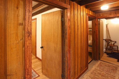 This home is perfect if you like wood.  The lot is loaded with on Hermitage Club Golf Course in Vermont - for sale on GolfHomes.com, golf home, golf lot