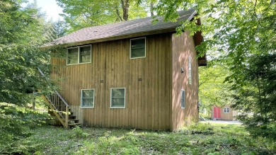 This home is perfect if you like wood.  The lot is loaded with on Hermitage Club Golf Course in Vermont - for sale on GolfHomes.com, golf home, golf lot