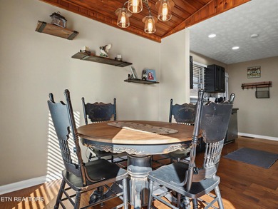 Want a comfortable cabin at the lake? This home offers wooded on The Greens at Deerfield in Tennessee - for sale on GolfHomes.com, golf home, golf lot