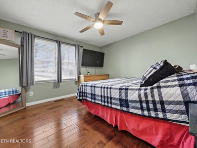 Want a comfortable cabin at the lake? This home offers wooded on The Greens at Deerfield in Tennessee - for sale on GolfHomes.com, golf home, golf lot