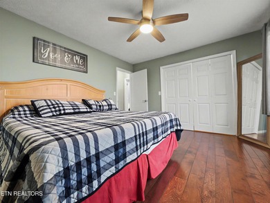 Want a comfortable cabin at the lake? This home offers wooded on The Greens at Deerfield in Tennessee - for sale on GolfHomes.com, golf home, golf lot