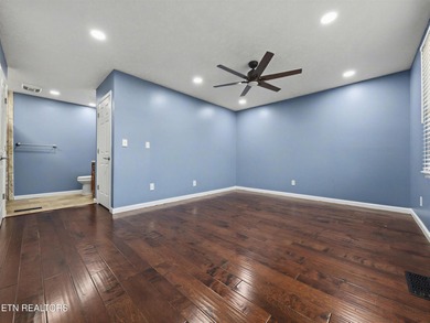 Want a comfortable cabin at the lake? This home offers wooded on The Greens at Deerfield in Tennessee - for sale on GolfHomes.com, golf home, golf lot