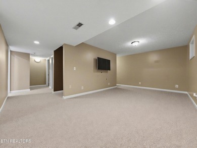 Want a comfortable cabin at the lake? This home offers wooded on The Greens at Deerfield in Tennessee - for sale on GolfHomes.com, golf home, golf lot