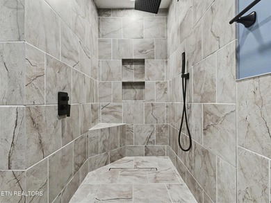 Want a comfortable cabin at the lake? This home offers wooded on The Greens at Deerfield in Tennessee - for sale on GolfHomes.com, golf home, golf lot