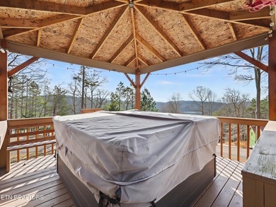 Want a comfortable cabin at the lake? This home offers wooded on The Greens at Deerfield in Tennessee - for sale on GolfHomes.com, golf home, golf lot