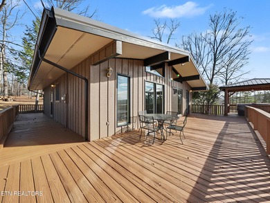 Want a comfortable cabin at the lake? This home offers wooded on The Greens at Deerfield in Tennessee - for sale on GolfHomes.com, golf home, golf lot