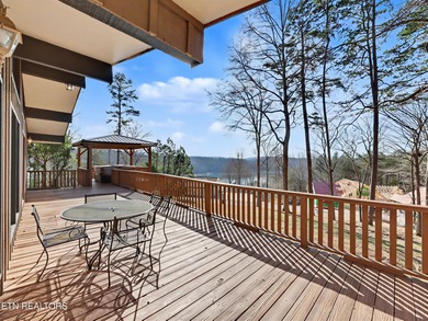 Want a comfortable cabin at the lake? This home offers wooded on The Greens at Deerfield in Tennessee - for sale on GolfHomes.com, golf home, golf lot