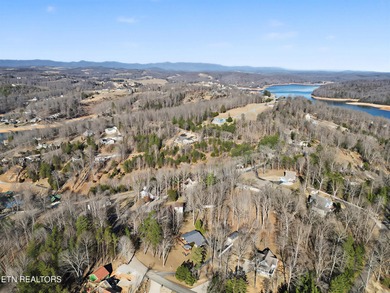 Want a comfortable cabin at the lake? This home offers wooded on The Greens at Deerfield in Tennessee - for sale on GolfHomes.com, golf home, golf lot