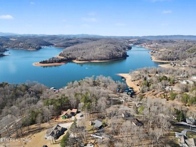 Want a comfortable cabin at the lake? This home offers wooded on The Greens at Deerfield in Tennessee - for sale on GolfHomes.com, golf home, golf lot