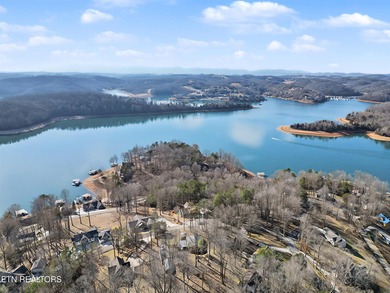 Want a comfortable cabin at the lake? This home offers wooded on The Greens at Deerfield in Tennessee - for sale on GolfHomes.com, golf home, golf lot