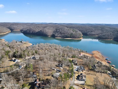Want a comfortable cabin at the lake? This home offers wooded on The Greens at Deerfield in Tennessee - for sale on GolfHomes.com, golf home, golf lot