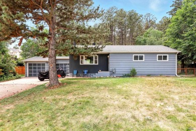 Welcome home to this spacious and full-of-character 5-bedroom on Meadowbrook Golf Course in South Dakota - for sale on GolfHomes.com, golf home, golf lot