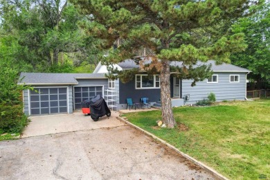 Welcome home to this spacious and full-of-character 5-bedroom on Meadowbrook Golf Course in South Dakota - for sale on GolfHomes.com, golf home, golf lot