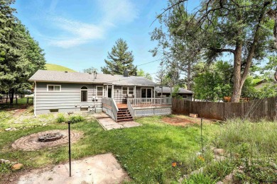 Welcome home to this spacious and full-of-character 5-bedroom on Meadowbrook Golf Course in South Dakota - for sale on GolfHomes.com, golf home, golf lot