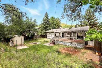 Welcome home to this spacious and full-of-character 5-bedroom on Meadowbrook Golf Course in South Dakota - for sale on GolfHomes.com, golf home, golf lot