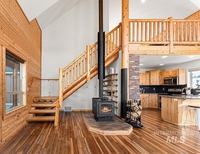 Custom-built timber cabin on over an acre with a 3-car garage on Terrace Lakes Golf Resort in Idaho - for sale on GolfHomes.com, golf home, golf lot