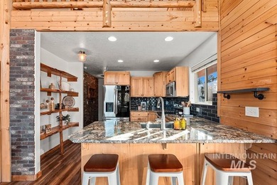 Custom-built timber cabin on over an acre with a 3-car garage on Terrace Lakes Golf Resort in Idaho - for sale on GolfHomes.com, golf home, golf lot