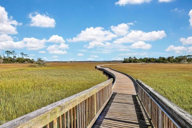 Resort-style living on a premium cul-de-sac lot overlooking the on The Palencia Club in Florida - for sale on GolfHomes.com, golf home, golf lot