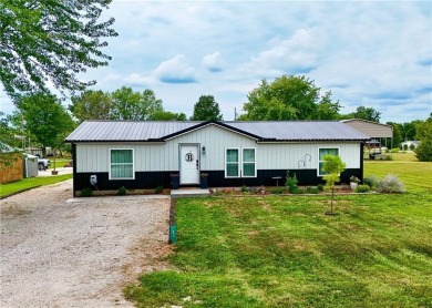 3 LOTS!!! The 3br 2 Ba updated in Rustic decor home is located on Linn Valley Lakes - Deer Trace Golf Course in Kansas - for sale on GolfHomes.com, golf home, golf lot