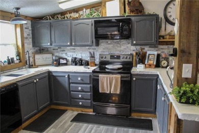 3 LOTS!!! The 3br 2 Ba updated in Rustic decor home is located on Linn Valley Lakes - Deer Trace Golf Course in Kansas - for sale on GolfHomes.com, golf home, golf lot