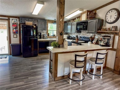 3 LOTS!!! The 3br 2 Ba updated in Rustic decor home is located on Linn Valley Lakes - Deer Trace Golf Course in Kansas - for sale on GolfHomes.com, golf home, golf lot