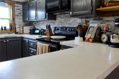 3 LOTS!!! The 3br 2 Ba updated in Rustic decor home is located on Linn Valley Lakes - Deer Trace Golf Course in Kansas - for sale on GolfHomes.com, golf home, golf lot