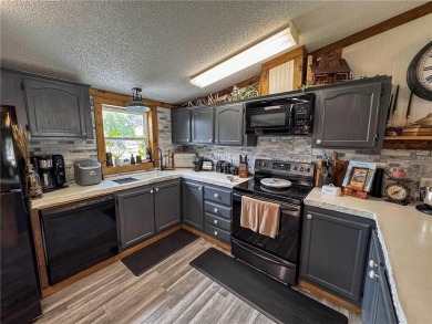 3 LOTS!!! The 3br 2 Ba updated in Rustic decor home is located on Linn Valley Lakes - Deer Trace Golf Course in Kansas - for sale on GolfHomes.com, golf home, golf lot