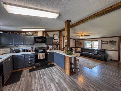 3 LOTS!!! The 3br 2 Ba updated in Rustic decor home is located on Linn Valley Lakes - Deer Trace Golf Course in Kansas - for sale on GolfHomes.com, golf home, golf lot