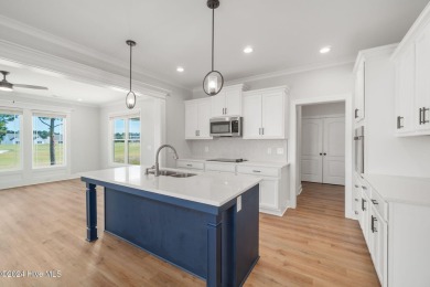 Discover coastal living at this new construction beauty in The on North River Club in North Carolina - for sale on GolfHomes.com, golf home, golf lot