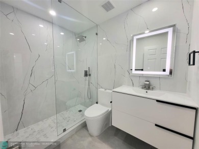Completely renovated home featuring 2 bedrooms, den, 2 bathrooms on Polo Club of Boca Raton in Florida - for sale on GolfHomes.com, golf home, golf lot