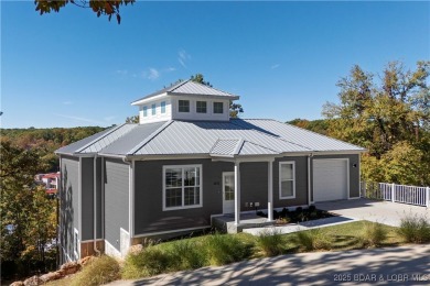 This beautiful 4-bedroom home offers great water views from one on The Oaks Golf Course in Missouri - for sale on GolfHomes.com, golf home, golf lot