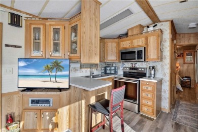 Experience the charm of relaxed Florida living in this lovingly on Del Tura Golf and Country Club in Florida - for sale on GolfHomes.com, golf home, golf lot