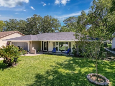 Nestled alongside the tranquil 14th hole of the golf course on Beacon Woods Golf Club in Florida - for sale on GolfHomes.com, golf home, golf lot