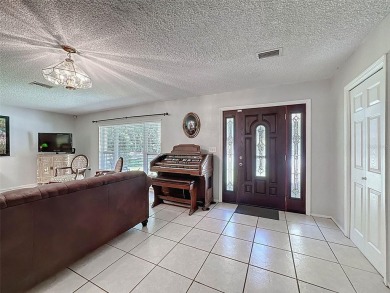 Nestled alongside the tranquil 14th hole of the golf course on Beacon Woods Golf Club in Florida - for sale on GolfHomes.com, golf home, golf lot