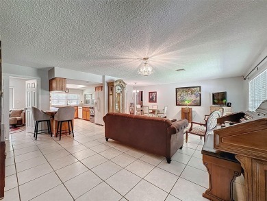 Nestled alongside the tranquil 14th hole of the golf course on Beacon Woods Golf Club in Florida - for sale on GolfHomes.com, golf home, golf lot