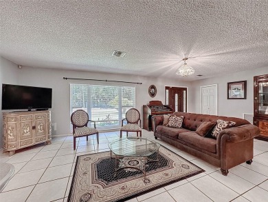 Nestled alongside the tranquil 14th hole of the golf course on Beacon Woods Golf Club in Florida - for sale on GolfHomes.com, golf home, golf lot