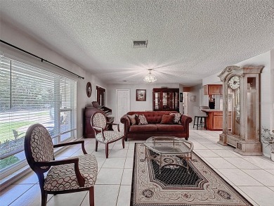 Nestled alongside the tranquil 14th hole of the golf course on Beacon Woods Golf Club in Florida - for sale on GolfHomes.com, golf home, golf lot