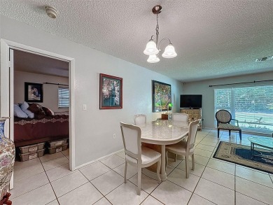 Nestled alongside the tranquil 14th hole of the golf course on Beacon Woods Golf Club in Florida - for sale on GolfHomes.com, golf home, golf lot