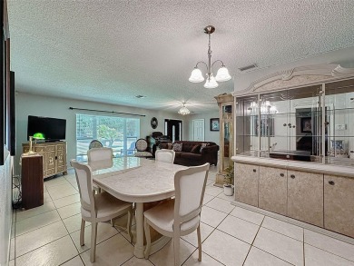 Nestled alongside the tranquil 14th hole of the golf course on Beacon Woods Golf Club in Florida - for sale on GolfHomes.com, golf home, golf lot
