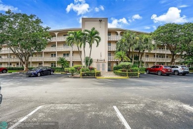 Deluxe Spacious Corner, Screened  Enclosed Balcony with Lake on Wynmoor Golf Course in Florida - for sale on GolfHomes.com, golf home, golf lot