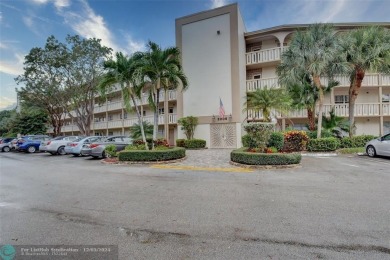 Deluxe Spacious Corner, Screened  Enclosed Balcony with Lake on Wynmoor Golf Course in Florida - for sale on GolfHomes.com, golf home, golf lot